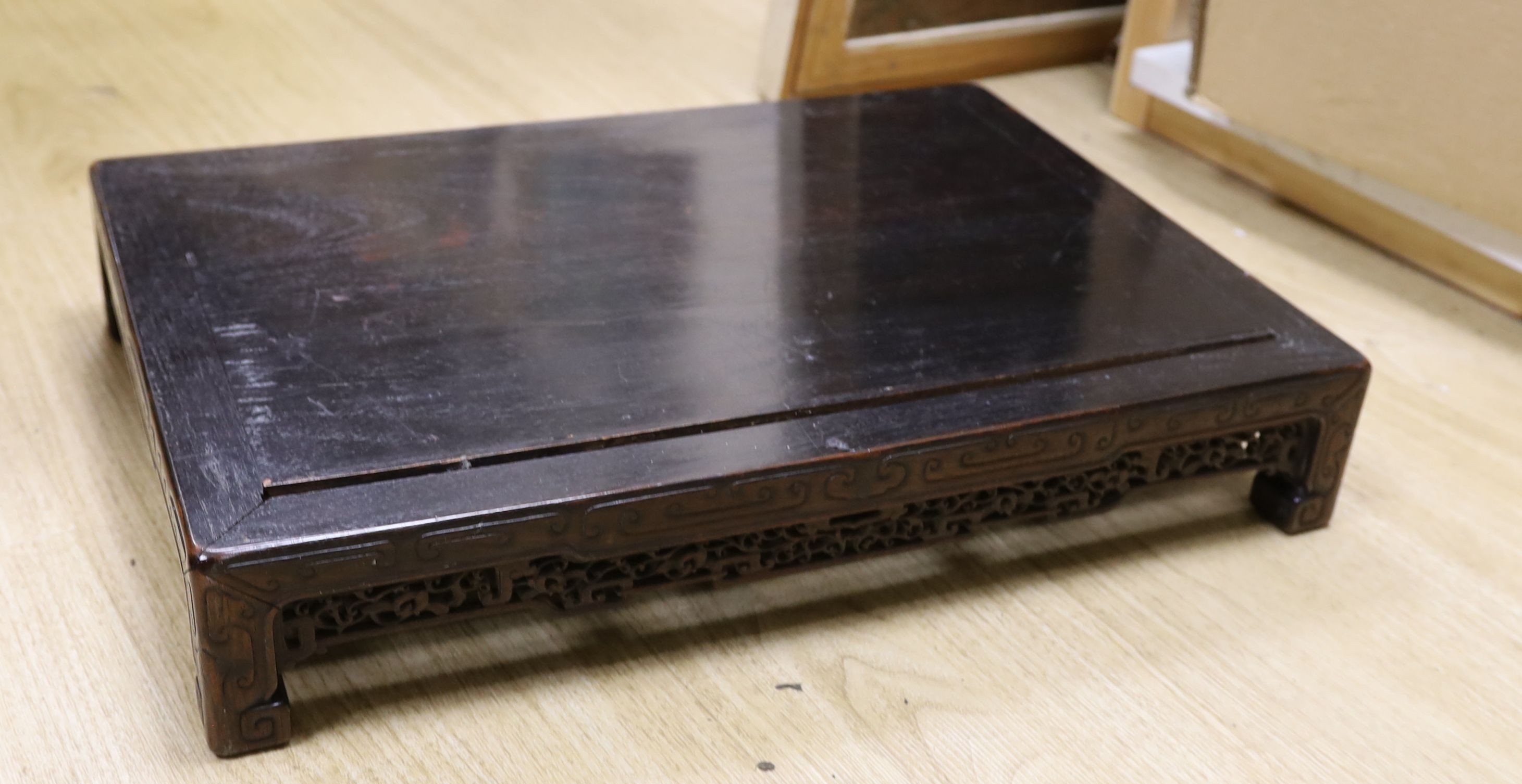 A 19th century Chinese hongmu low stand - 51cm long